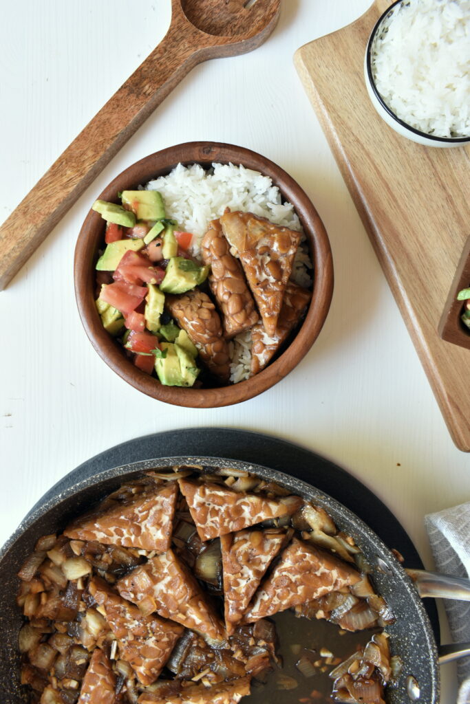 Vegan Tempeh Adobo recipe in a bowl with rice and fresh salsa