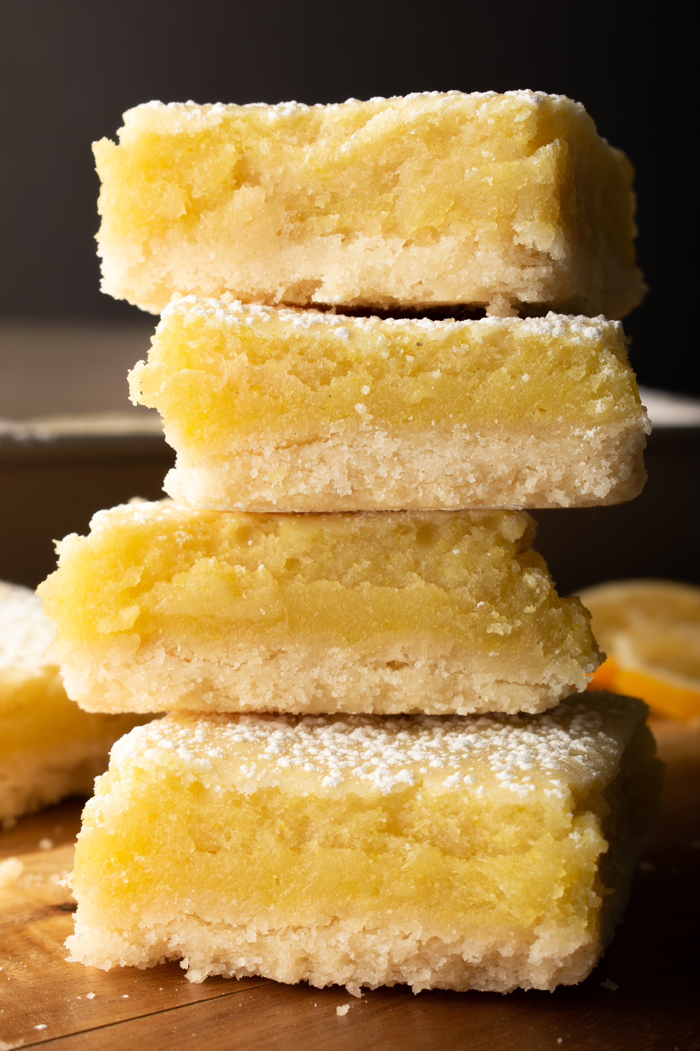 Vegan Lemon Squares with a shortbread cookie layer, topped with icing sugar
